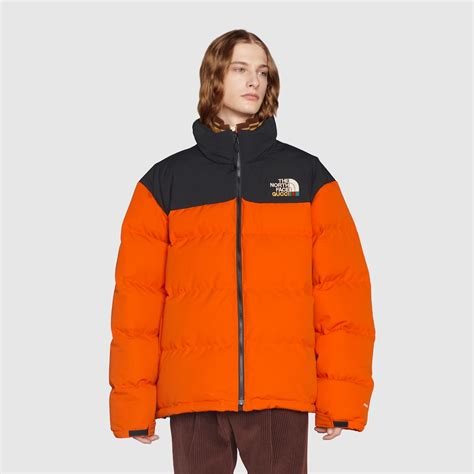 orange north face gucci jacket